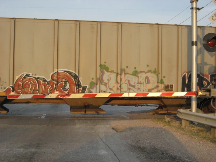 there is a very large semi truck with graffiti on it's bed
