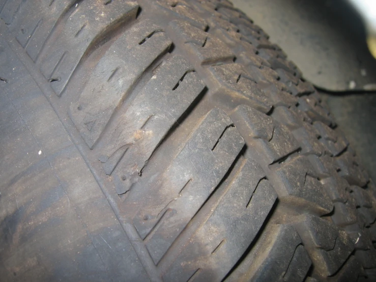 a close up of a tire that is on the floor