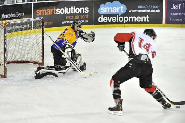 two hockey players playing in a game with each other