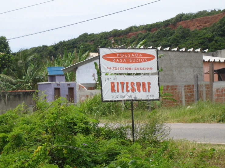 a sign is shown near a dirt road