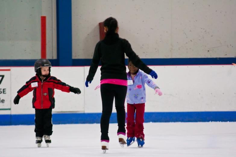 two people are on the ice skating together