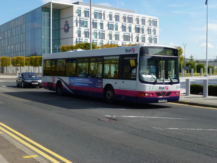 a bus on a street in a city with tall buildings