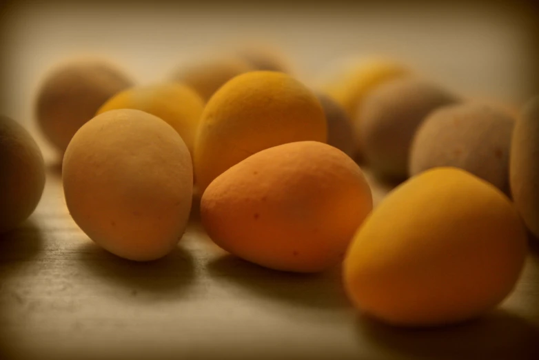 an image of several peaches and two oranges