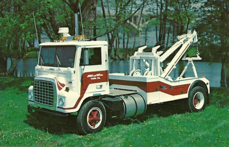 this is an older white red and black tow truck