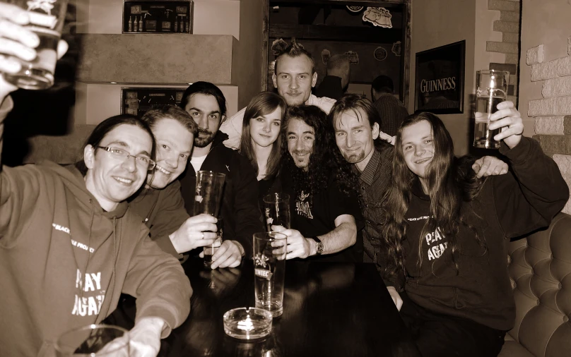 friends drinking and toasting in a bar