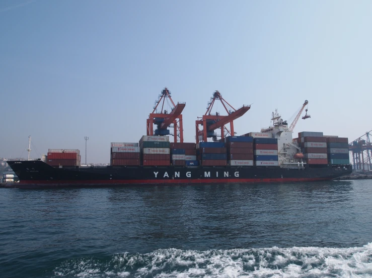 large ship in the ocean with a large crane on top