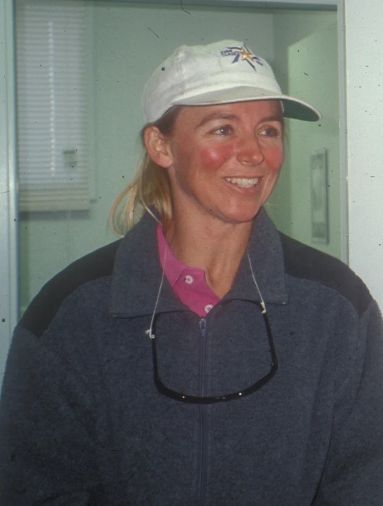 a woman wearing a white hat and jacket