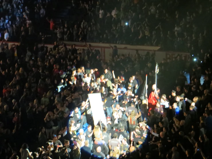 the view from the top of the stands in front of the audience at a football game