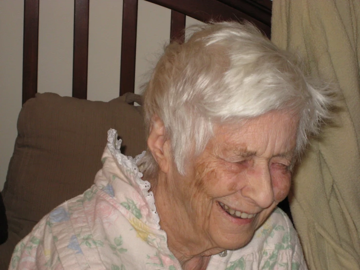 a woman that has white hair in a chair