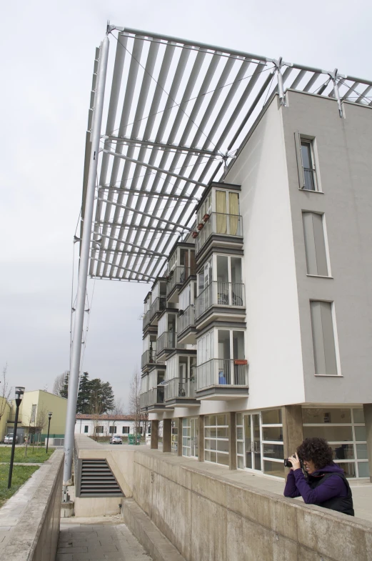 person taking po of a building on street