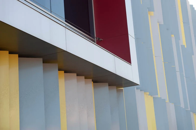 a modern building with large vertical striped facade