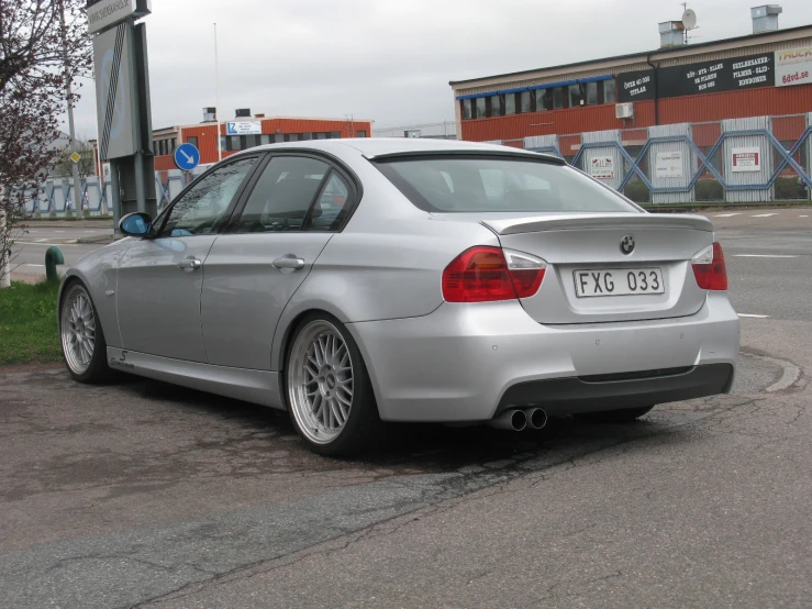 a silver car parked next to the curb