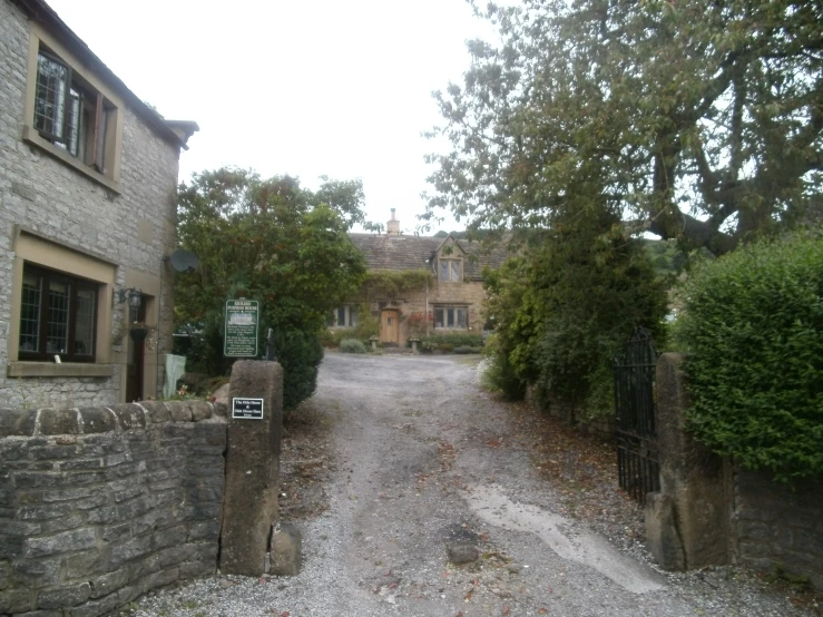 a street with houses and some trees in front