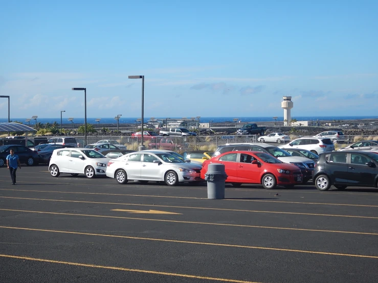 the parking lot at a motel with cars parked on it