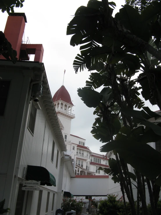 a clock tower with red domes on top on a building