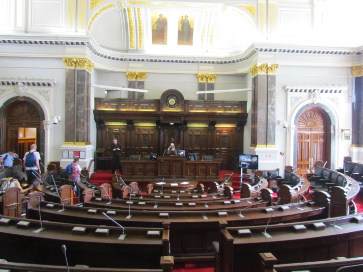 an empty, stately room with a speaker in the middle