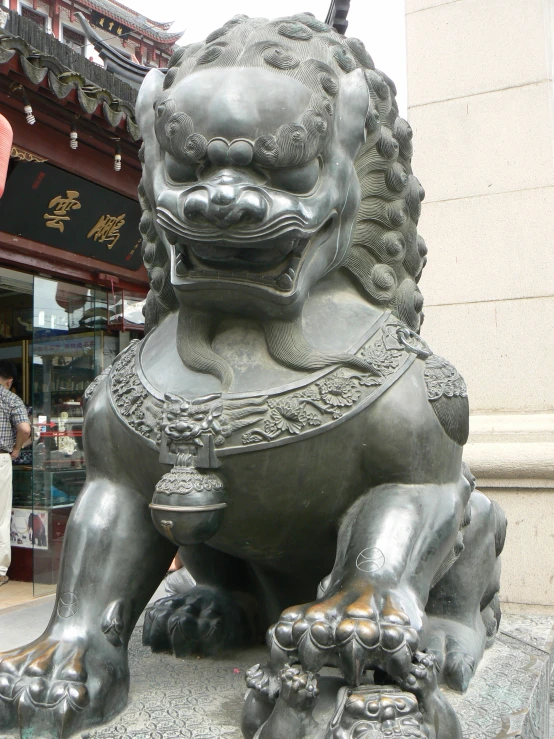 a statue of an animal is on a stone slab