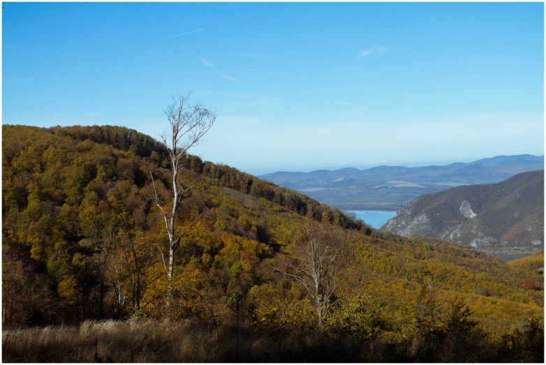 a view of some hills and a body of water in the distance