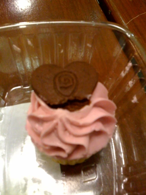this cupcake has been frosted with chocolate
