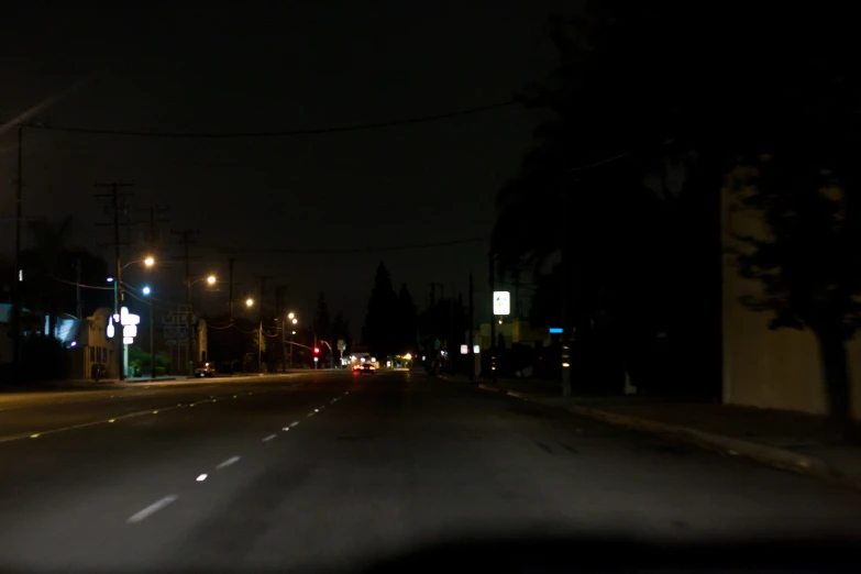 a street at night with lights on with no traffic