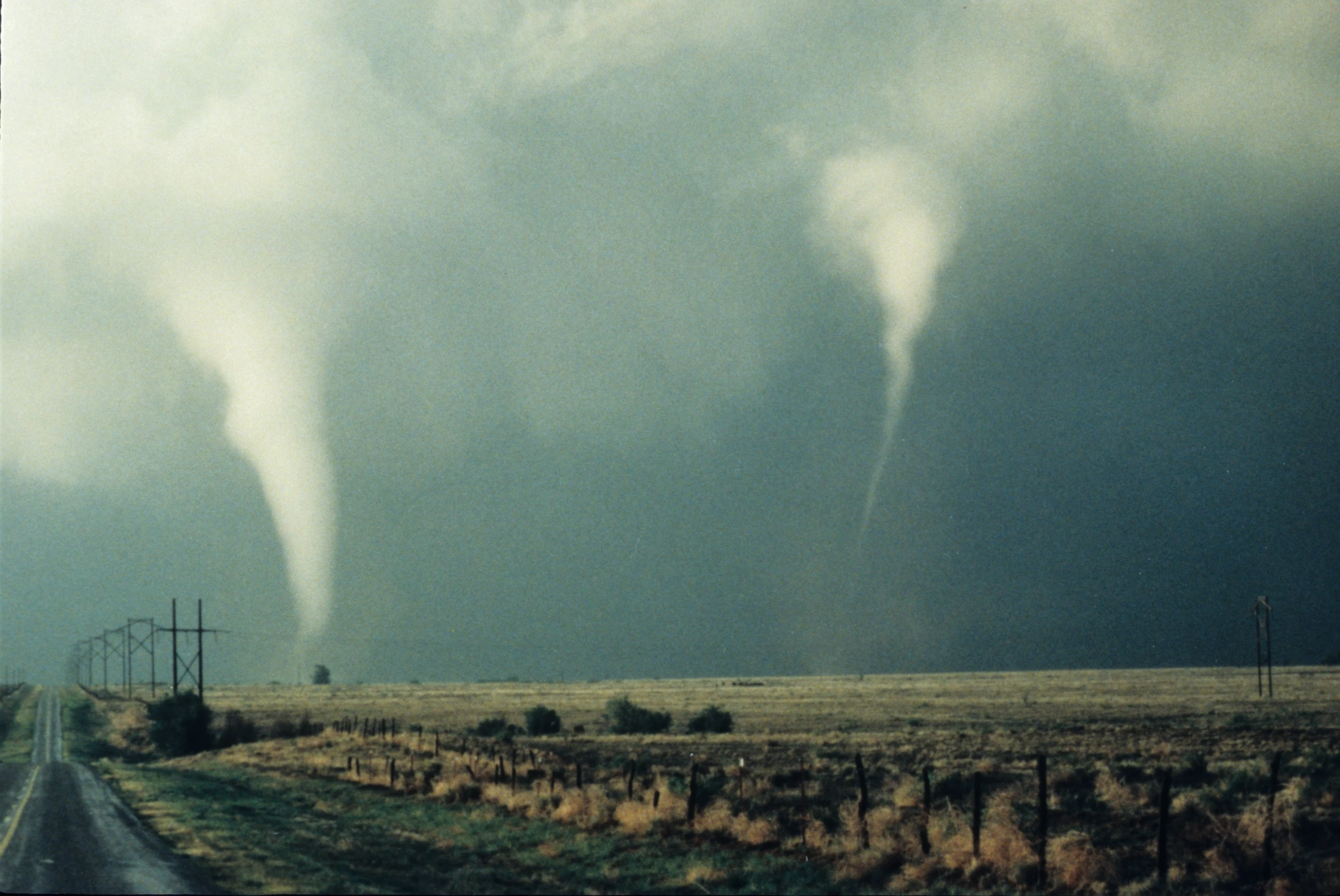 two funnels of water make their way down the road