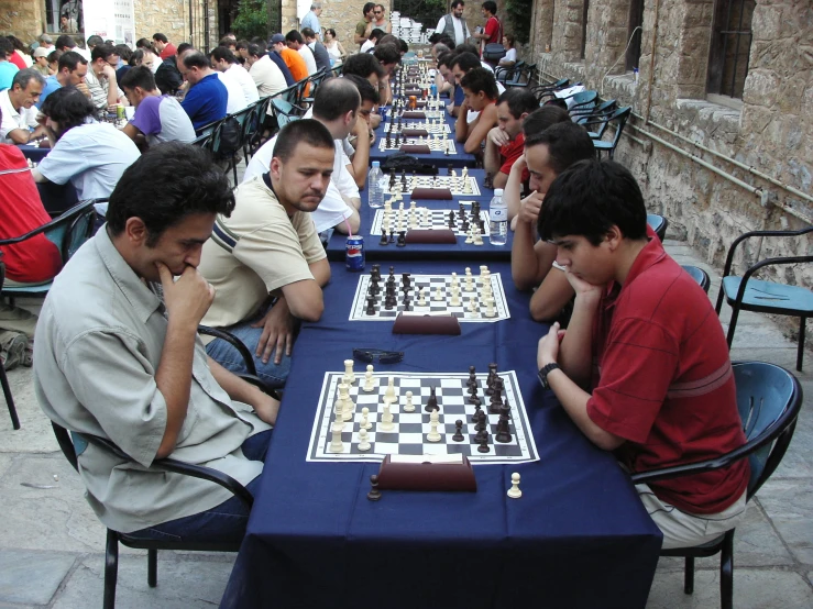 a large group of people sitting around a table