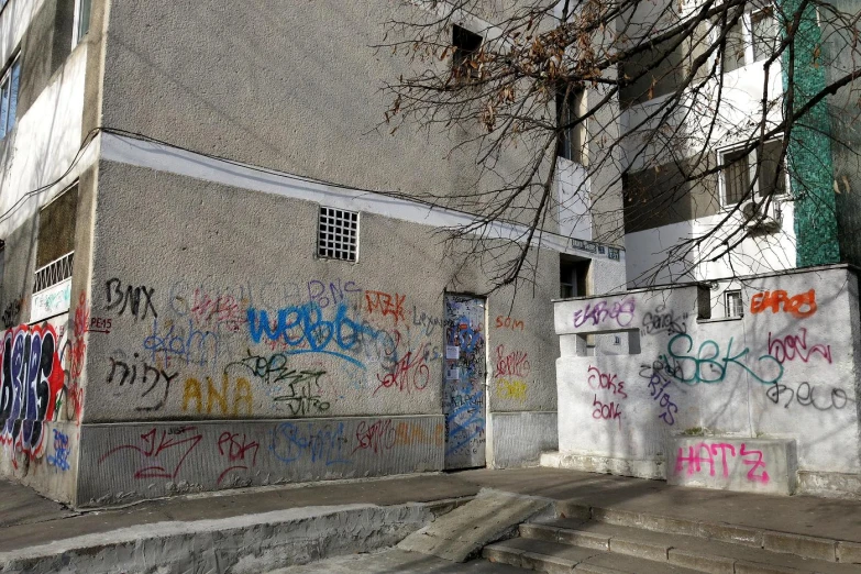 a street corner that is lined with lots of graffiti