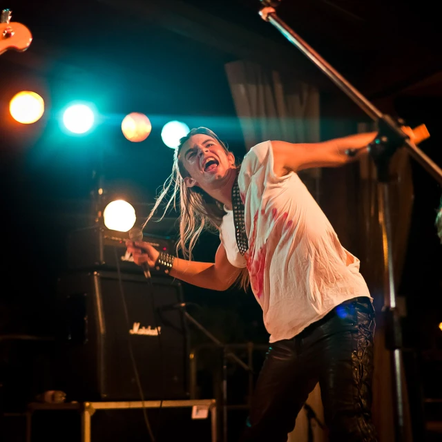 a girl with her arms up and arms out in front of the camera