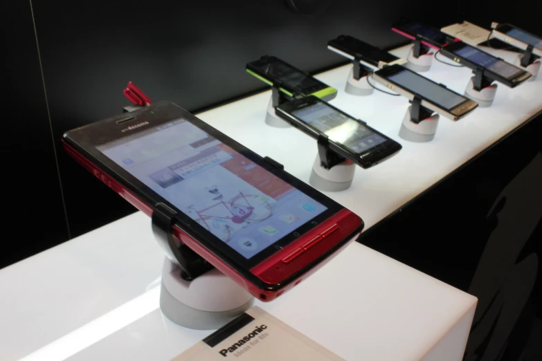 an open display case with various cell phones on it