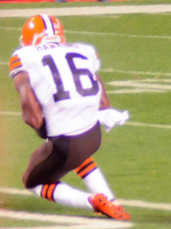 the football player is running with the ball