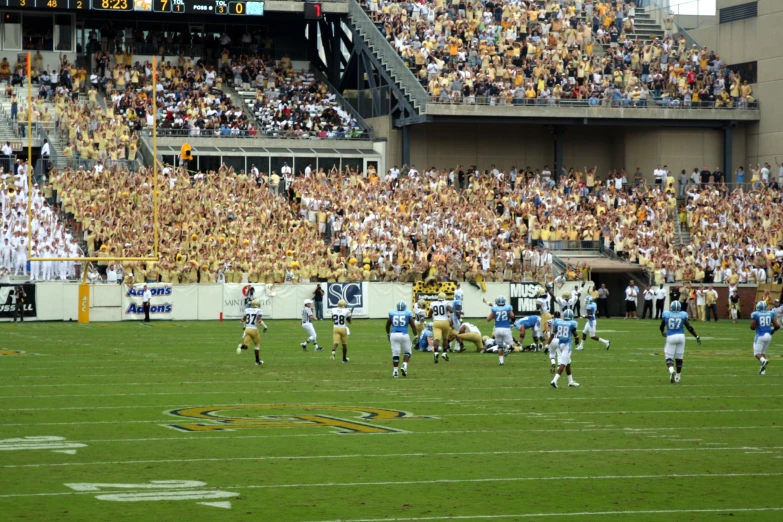 the fans are clapping in the stadium to see the game