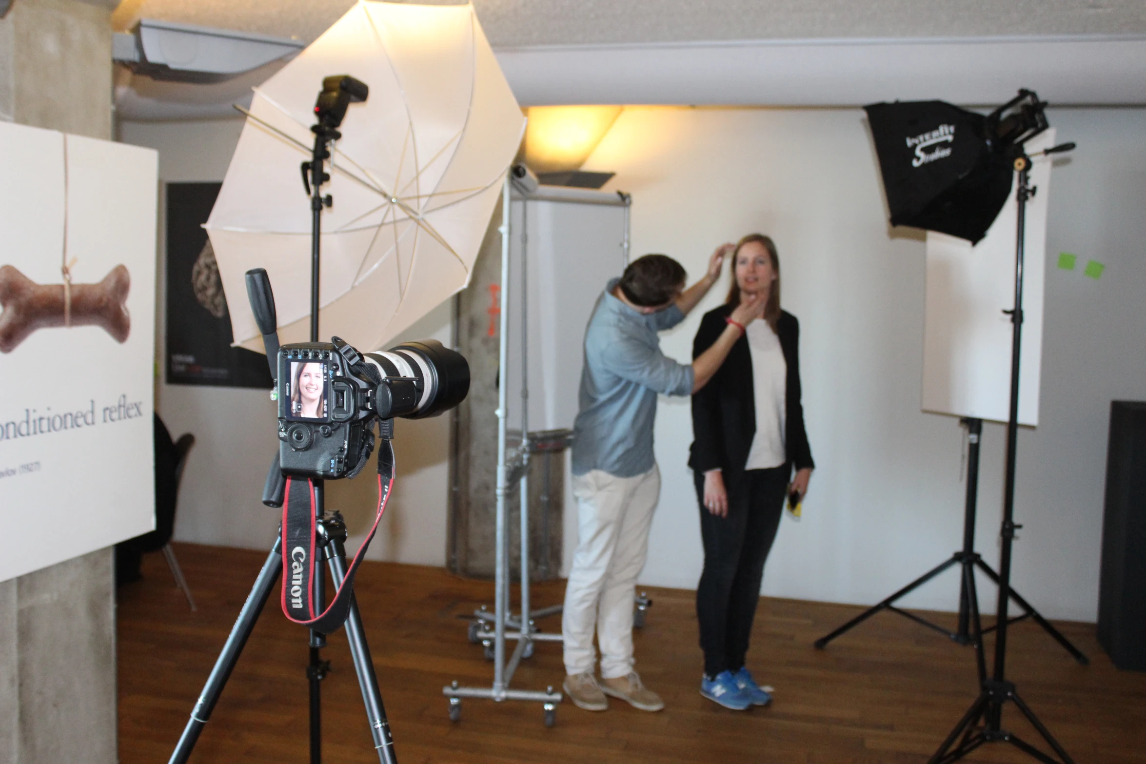 woman and man filming on the set of an interview