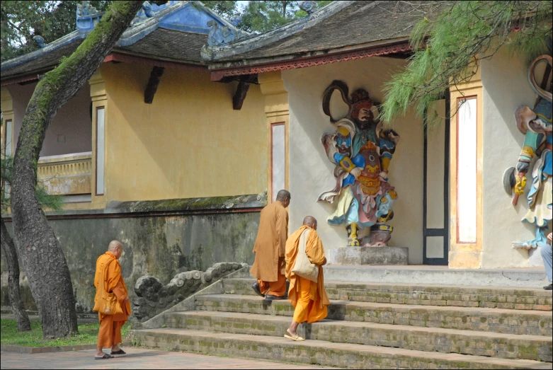 some people standing on steps in front of a building