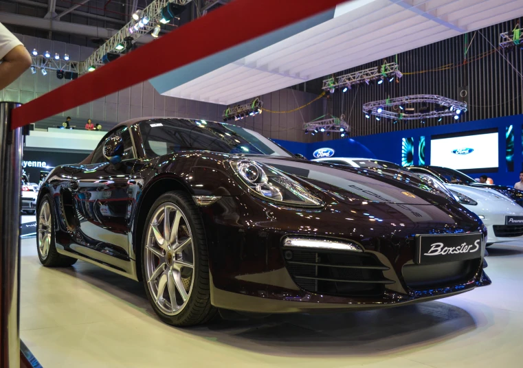 an exotic sport car in a showroom during the day