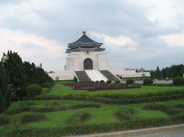 the white building has a circular clock tower