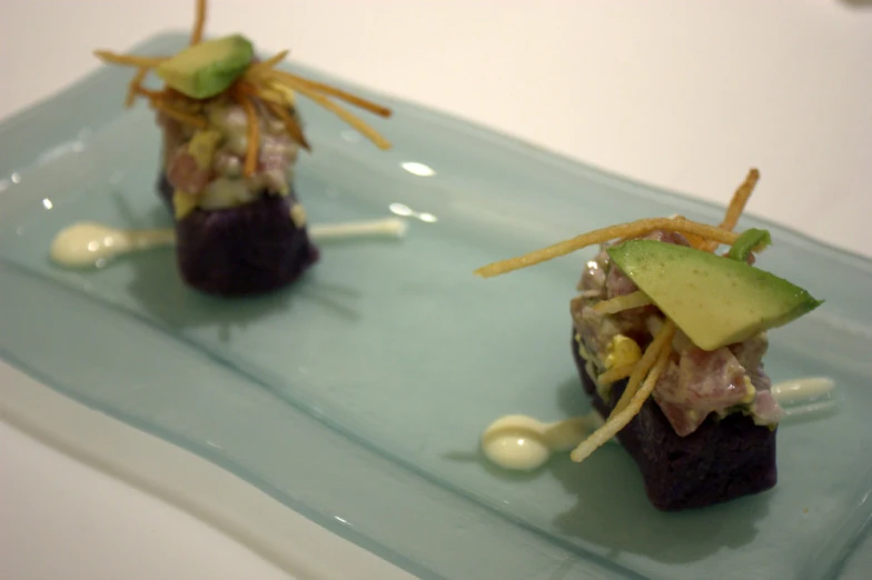 two food items arranged on top of a glass plate