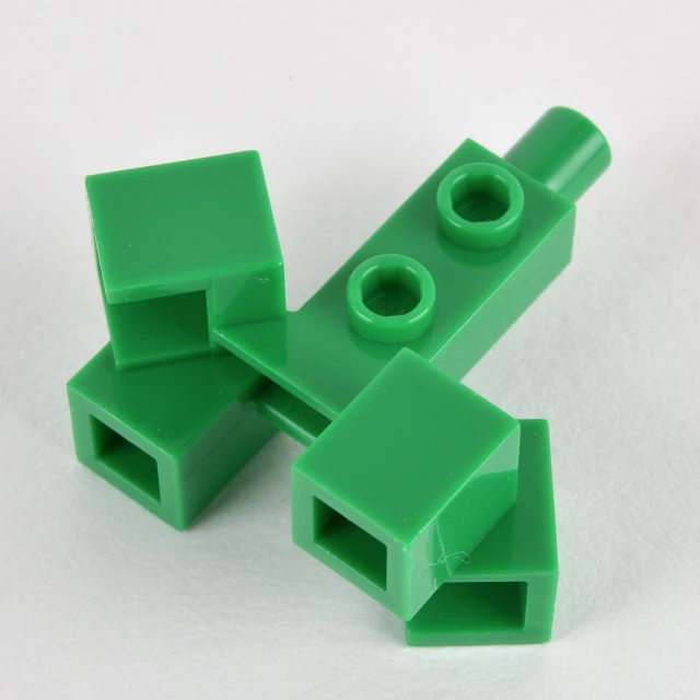 two green lego pieces stacked on top of each other