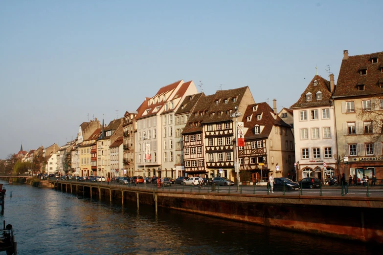 buildings along the water side next to a pier