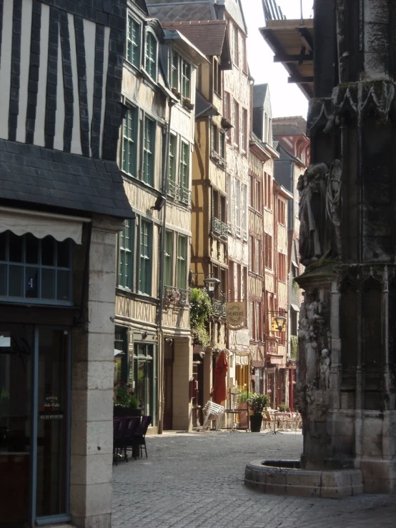 small town with numerous buildings, a clock, and statues