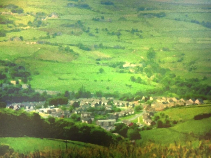 the view looking down at houses on the mountains