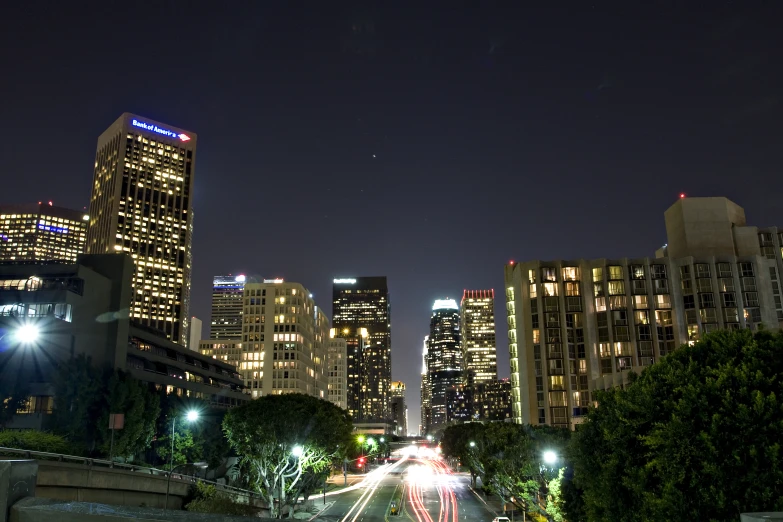 the city street is long and full with cars