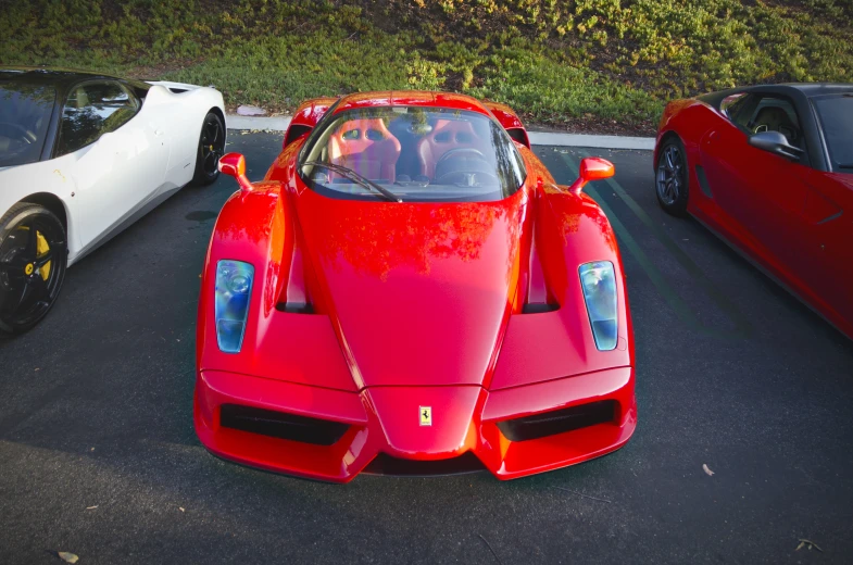 two sports cars parked next to each other