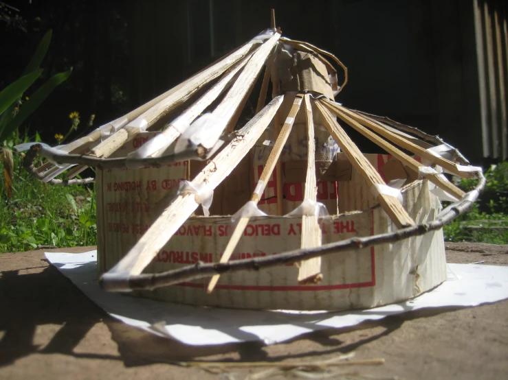 a wooden structure made from wood sticks and wire