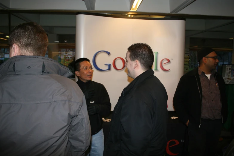 a group of people looking at a wall sign