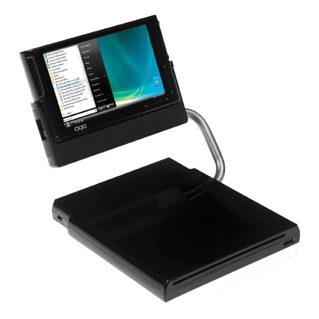a tablet computer sitting on top of a black book