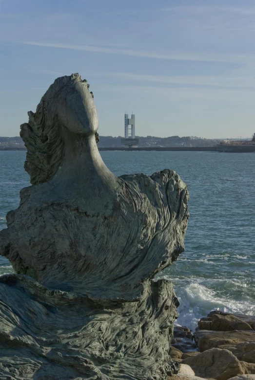 a rock in the middle of a body of water