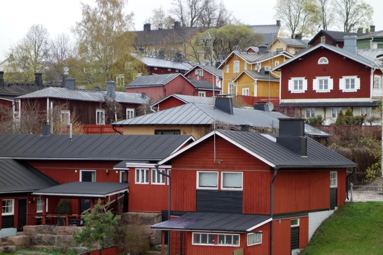 a row of houses next to each other on a hillside