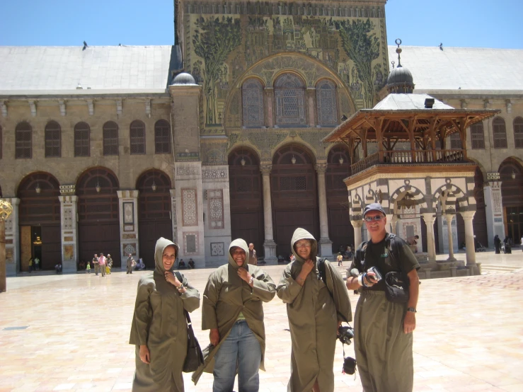 four women in uniforms posing for a picture