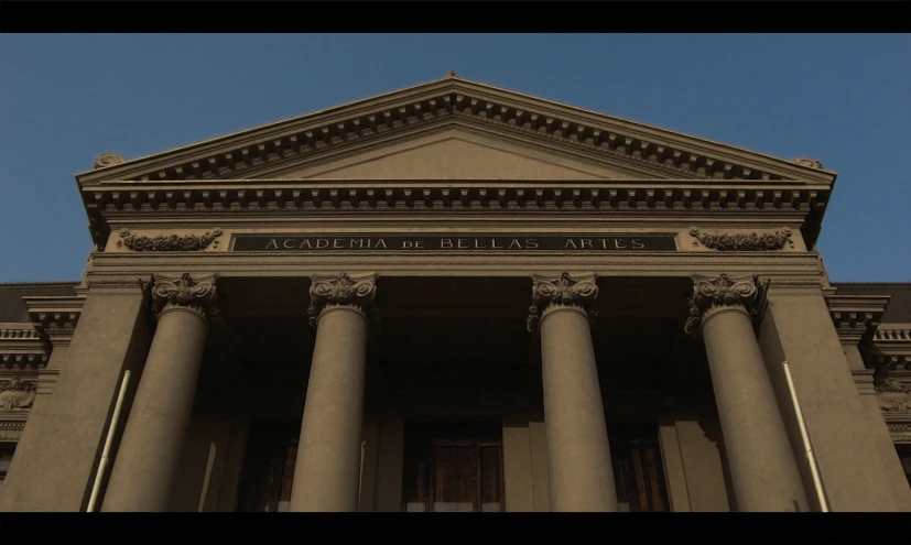 an old building with stone columns and carvings