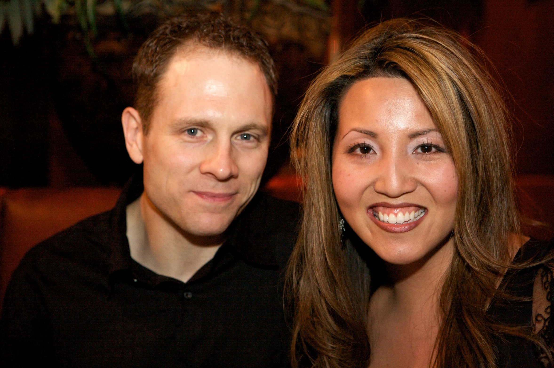 a man and a woman are posing for a po